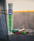 Jalapeño beef stick with fresh jalapeños on a fence post
