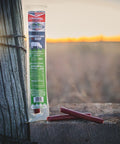 Original beef stick on a ranch fence post at sunset